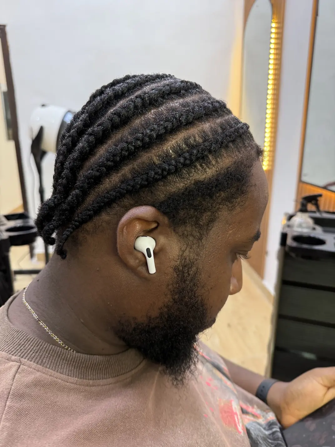 A client during a consultation, hair sectioned for a scalp check